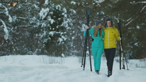 A-man-and-woman-cross-country-skiing-in-the-winter-forest
